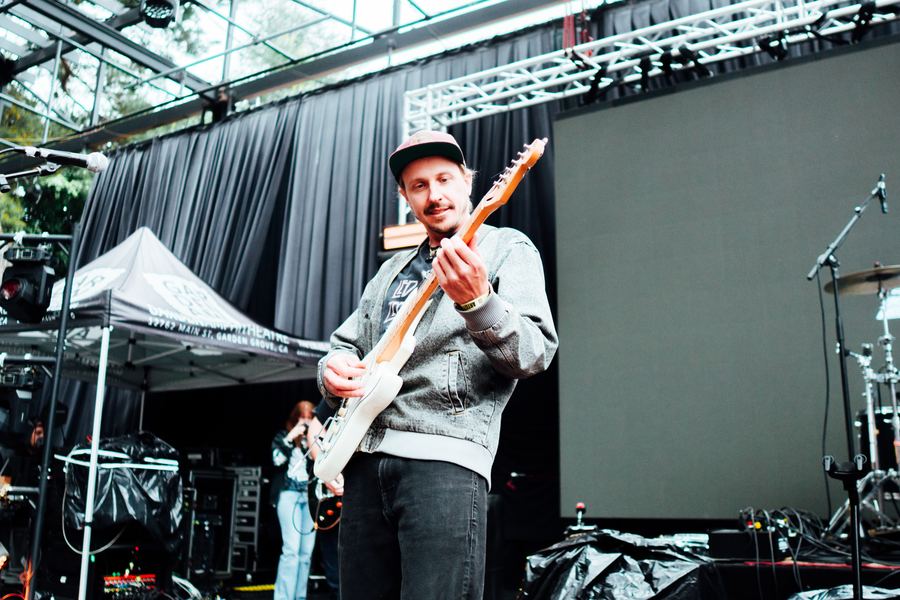 Musician performing on stage during a live set