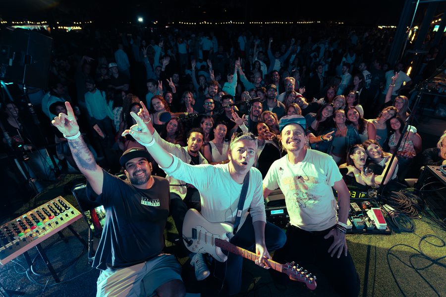 Band playing up close with the crowd behind them